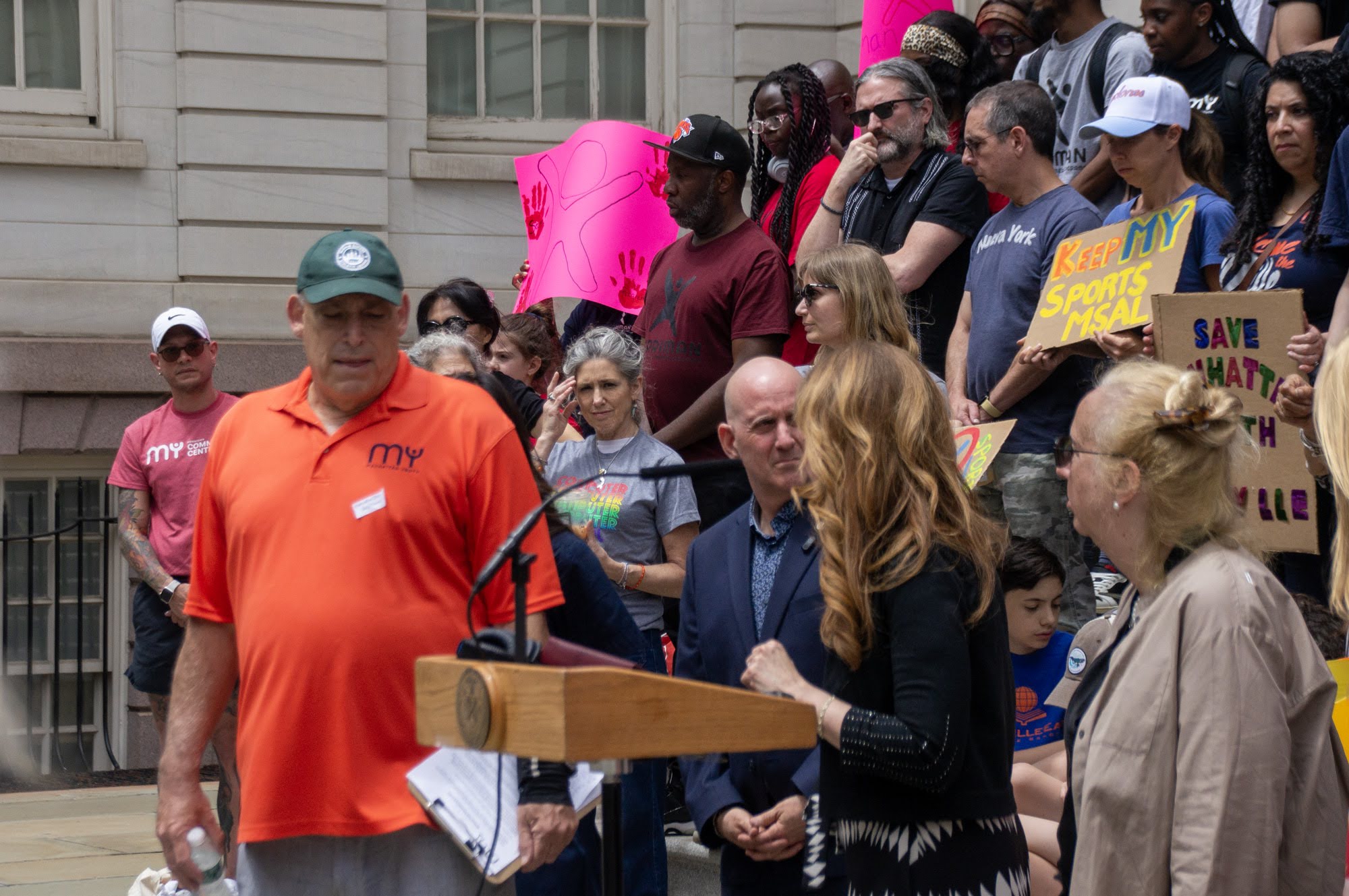 At the podium: families call on DYCD to show the plan.