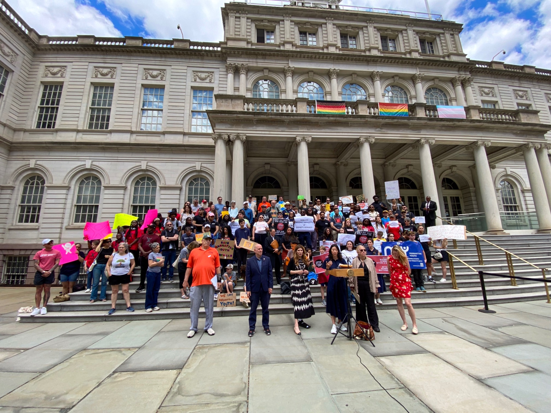 Parents, students, providers, and elected officials gather on the City Hall steps.